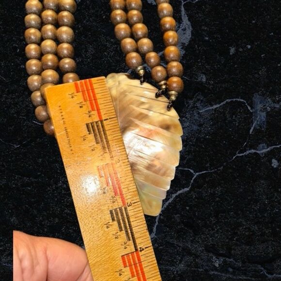 Elegant Brown Wooden Beaded Necklace with Carved Mother of Pearl Leaf Pendant - Picture 10 of 11